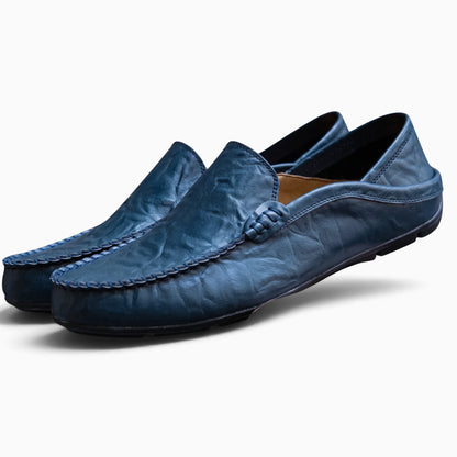 Détail de la semelle du mocassin blanc cuir homme, conçue pour la marche