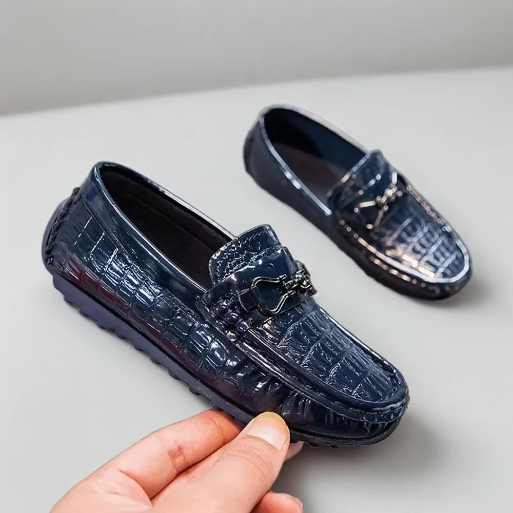 Paire de mocassins enfant garçon noirs, style épuré avec touche élégante