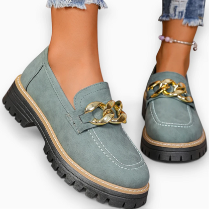 Mocassins femme talon compensé noirs vus de profil montrant la hauteur discrète du talon