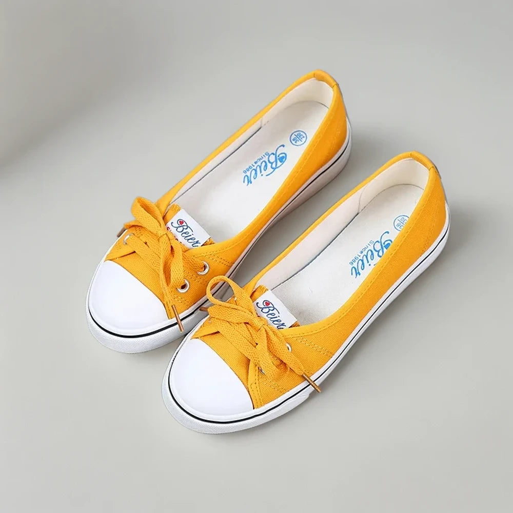 Mocassin penny jaune pour femme, semelle vulcanisée et matière souple