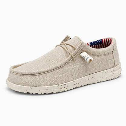 Sneaker mocassin gris clair avec semelle vulcanisée, profil latéral